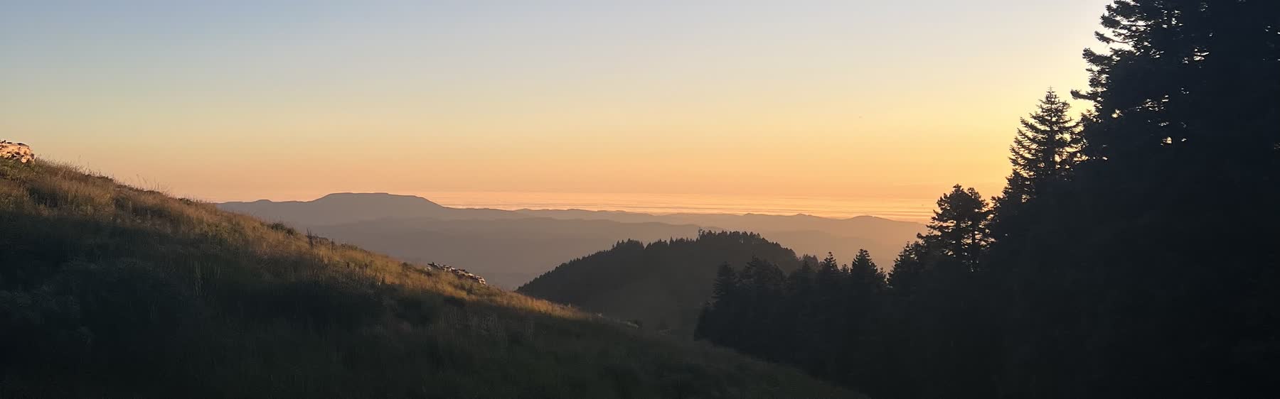 Sunset over ridgelines and treeline