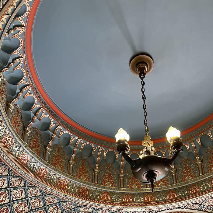 Painted dome ceiling with a hanging lamp
